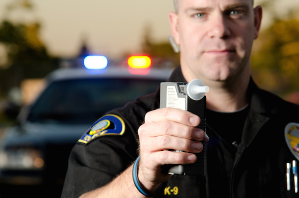 A police officer holding a breath test machine with his police car in the background. *the officer was blurred on purpose. Profile Photos of Law Office of Attorney Robert H. Prince 68 North Broadway - Photo 6 of 9