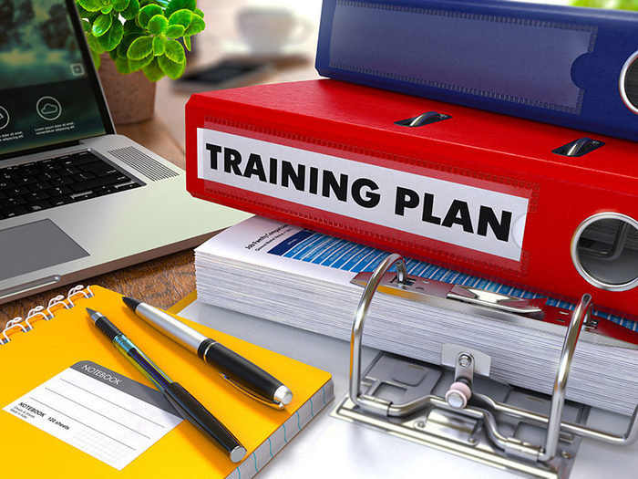 Red Ring Binder with Inscription Training Plan on Background of Working Table with Office Supplies, Laptop, Reports. Toned Illustration. Business Concept on Blurred Background. New Album of Mitch Gibson - Business Coach 53 Cook Parade - Photo 1 of 5 Red Ring Binder with Inscription Training Plan on Background of Working Table with Office Supplies, Laptop, Reports. Toned Illustration. Business Concept on Blurred Background. New Album of Mitch Gibson - Business Coach 53 Cook Parade - Photo 1 of 5