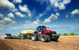 tractor in a field plowing, Cedar Valley Farm Supplies, St Jacobs