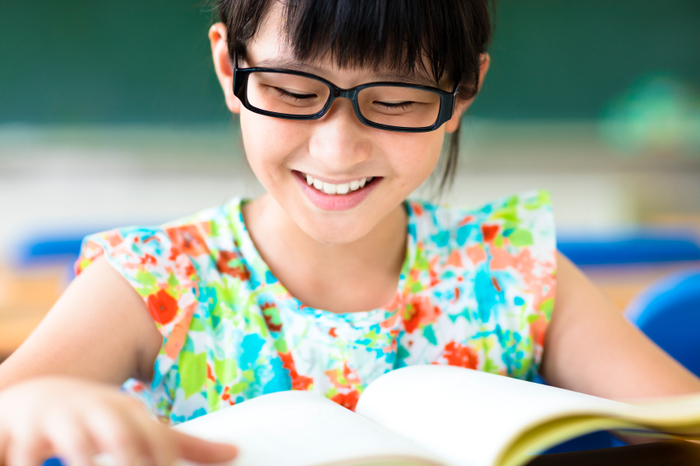 happy little girl studying in the classroom  Tutoring Club of Allen of Tutoring Club of Allen 602 E. Main St. Suite D - Photo 3 of 3
