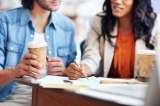Cropped image of two architects enjoying coffee as they work on a project together, Smart Electrix, London