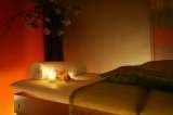 Massage table with candle and orchids Acupuncture & Alternative Health Care Concepts,Inc. 10645 Riverside Drive 
