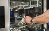 Technician repairing the dishwasher, Appliance Repair Maplewood, Maplewood