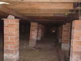 Piers that are out of plumb & note packing to closest pier.
, Brent Heness Inspections, Brightwaters