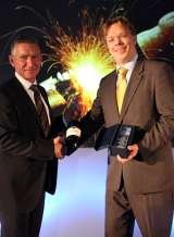 Pix - Madpix - 26/11/11 - 2011m&cAGM94 <br />
The 2011 Annual Martin & Co Conference at the Chesford Grange Hotel in Kenilworth. <br />
Awards presentations. (LEFT) Chairman Richard Martin presents the award to Dennis Roodhardt - Folkeston - in the Most Successful Yo Martin & Co Folkestone 130 Sandgate Road 