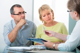 Mature couple getting financial advice from consultant at home
** Note: Shallow depth of field, Attorney Amy Moore, Mt. Vernon