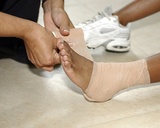 mother bandaging child's foot                                Norfolk Foot & Ankle Group 3509 Granby Street 