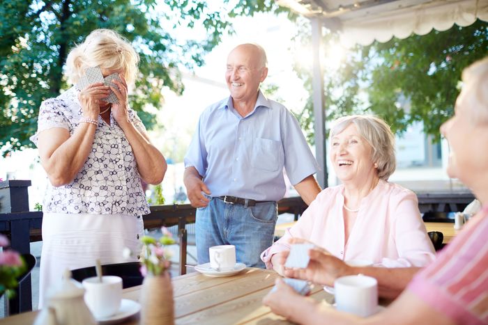 Laughing seniors spending leisure in outdoor cafe Profile Photos of Heatherwood Senior Living 5277 W. Kootenai St - Photo 3 of 4