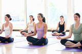 Women practicing yoga in a class, ID YOGA, Buckinghamshire