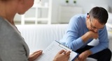 Female psychologist consulting pensive man during psychological therapy session Dr. Lyn Turcotte 16 Monsignor Crosby Avenue 