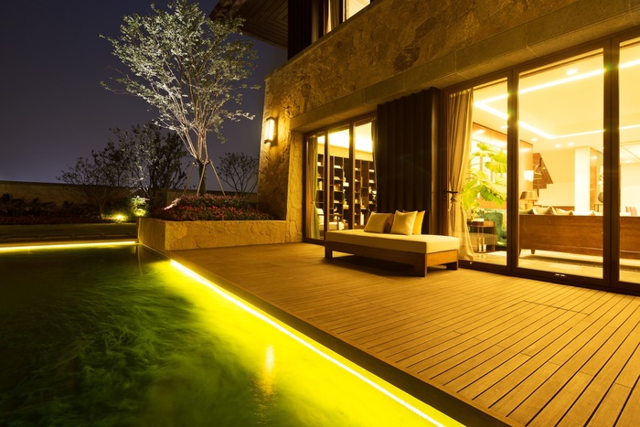 bench on wooden floor near pond at night Playa Vista Electrician of Playa Vista Electrician 8314 Colegio Dr - Photo 4 of 5