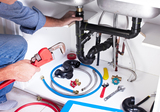 Plumber hands with a wrench. Plumbing renovation background. City Wide Plumbing of Mesa 1559 N Country Club Dr 