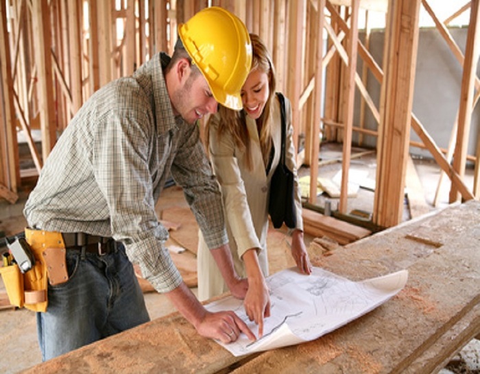 A home designer working with a home buildering and inspecting the blueprints Services of Edward Lukac Architect 4 Cranwell st. - Photo 6 of 9 A home designer working with a home buildering and inspecting the blueprints Services of Edward Lukac Architect 4 Cranwell st. - Photo 6 of 9