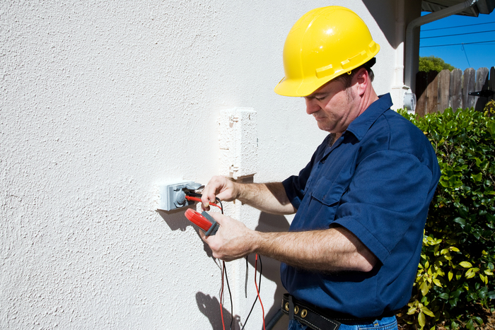 Electrician measuring voltage on an outdoor electrical receptacle. Plenty of room for text. <br />
Model is an actual electrician and all work is being performed according to industry safety and code standards. New Album of AAA Electric Company Inc 6525 Gunpark Dr. - Photo 3 of 9 Electrician measuring voltage on an outdoor electrical receptacle. Plenty of room for text. <br />
Model is an actual electrician and all work is being performed according to industry safety and code standards. New Album of AAA Electric Company Inc 6525 Gunpark Dr. - Photo 3 of 9
