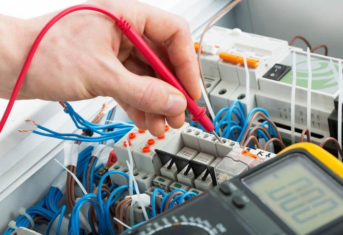 Hand of an electrician with multimeter probe at an electrical switchgear cabinet New Album of AAA Electric Company Inc 6525 Gunpark Dr. - Photo 7 of 9 Hand of an electrician with multimeter probe at an electrical switchgear cabinet New Album of AAA Electric Company Inc 6525 Gunpark Dr. - Photo 7 of 9