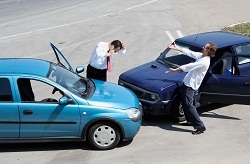 Traffic accident - one driver on the mobile phone, second expressing anger Profile Photos of Insurance Center 1015 St Clair Plaza Dr - Photo 2 of 3