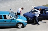 Traffic accident - one driver on the mobile phone, second expressing anger, Insurance Center, Saint Clair