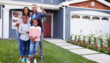 Happy black family standing outside their house, dad holding the key Spencer Savings Bank 9 Bloomfield Avenue 