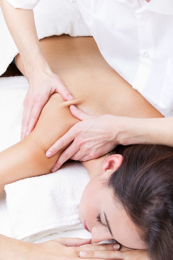 Pretty Woman enjoying shoulder massage at beauty spa Profile Photos of Ruby's Hair & Beauty Salon 635 High Road Leytonstone - Photo 3 of 11