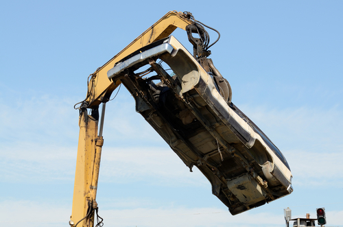 Large excavator with a claw crushing and piling old cars at a metal recycle plant Profile Photos of Junk My Car Detroit 13840 Fenkell Ave - Photo 2 of 10 Large excavator with a claw crushing and piling old cars at a metal recycle plant Profile Photos of Junk My Car Detroit 13840 Fenkell Ave - Photo 2 of 10