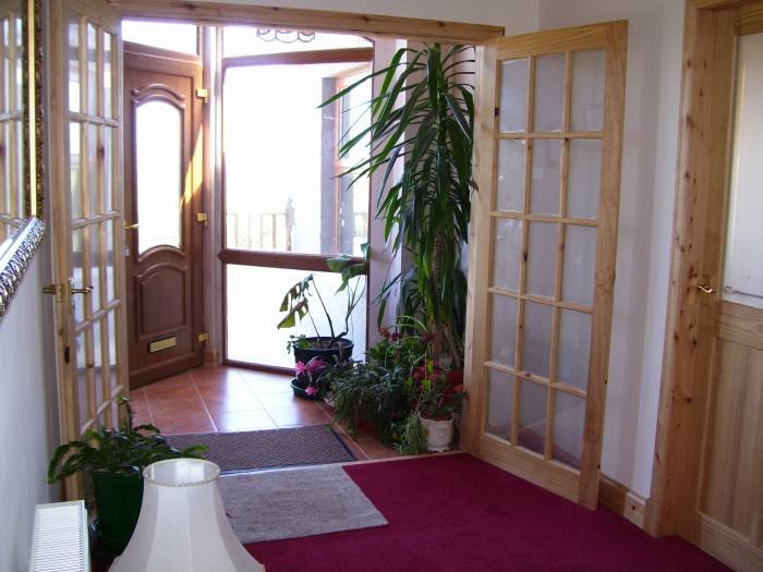 Dining Hall with views to the sea. New Album of East Muntloch Croft Bed & Breakfast and Auld Smiddy & Glen Auchie Holiday Cottages East Muntlloch Croft B & B, Cairngaan Road, - Photo 2 of 6