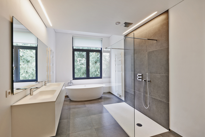 Bathtub in corian, Faucet and shower in tiled bathroom with windows towards garden Profile Photos of Bison Electrical Limited 46 Marquis Rd, Stroud Green, London N4 3AP - Photo 6 of 7