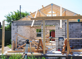 Building New House from Autoclaved Aerated Concrete Blocks with Roofing Construction. Wooden Roof Frame House Construction, International Concrete and Cutting Service, Clayton