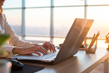 Adult businesswoman working at home using computer, studying business ideas on a pc screen on-line, Nano Second Computers, Atlanta
