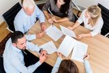 51756055 - lawyers having team meeting in law firm reading documents and negotiating agreements, Immigration Lawyer Staten Island, Staten Island