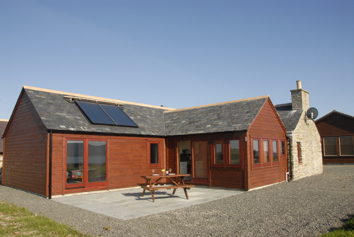 Private back patio for alfresco dining Croft House sleeping 8 in 2 doubles and 2 bunk bed of Buxa Farm Chalets & Croft House A964 - Photo 7 of 18