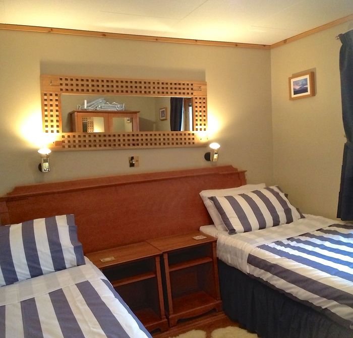 Twin beds can be put together to form a king bed 3 chalets sleeping 4 each in king and/or twin beds of Buxa Farm Chalets & Croft House A964 - Photo 16 of 16