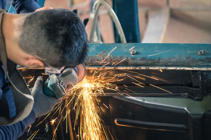 Young man mechanical worker repairing an old vintage car body in messy garage - Safety at work with protection wear Profile Photos of Marquis Auto Body Repair 4711 W Hallandale Beach Blvd, Pembroke Park, FL, 33023 - Photo 1 of 1