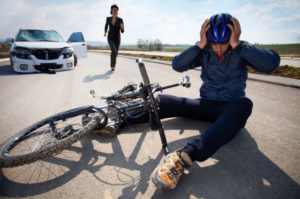 Bicyclists injured in a car accident lying down on the road and holding his head with helmet. A person who is driving car running to helps to injured man Profile Photos of Los Angeles Bicycle Law, Bike Accident Attorney 3415 S Sepulveda Blvd, Ste 1100 - Photo 4 of 6 Bicyclists injured in a car accident lying down on the road and holding his head with helmet. A person who is driving car running to helps to injured man Profile Photos of Los Angeles Bicycle Law, Bike Accident Attorney 3415 S Sepulveda Blvd, Ste 1100 - Photo 4 of 6