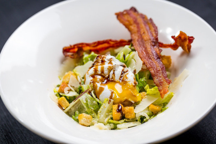 Caesar Salad - With Romaine, Poached Eggs, Anchovy<br />
Pancetta, Parmesan Crisp & Roasted Garlic Dressing Cotton Dinner & Tapas Menu of Cotton 902 East Coast Parkway, #01-26 - Photo 1 of 10 Caesar Salad - With Romaine, Poached Eggs, Anchovy<br />
Pancetta, Parmesan Crisp & Roasted Garlic Dressing Cotton Dinner & Tapas Menu of Cotton 902 East Coast Parkway, #01-26 - Photo 1 of 10