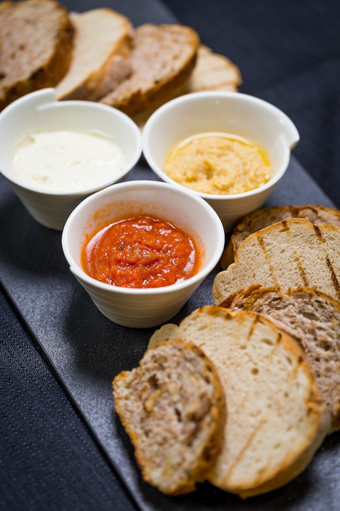 Freshly Baked Rustic Bread With Dips Cotton Dinner & Tapas Menu of Cotton 902 East Coast Parkway, #01-26 - Photo 2 of 10