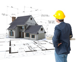 
Architect looking at House mock-up on top of blueprints with pen notes and corrections
, Nuwave Construction and Restoration LLC, Philadelphia