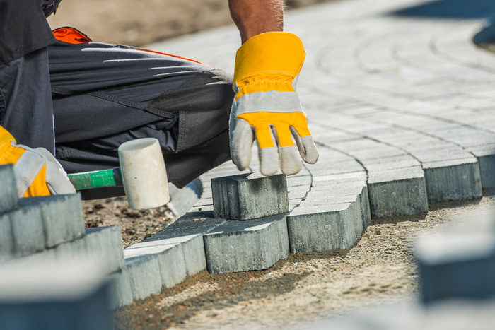 Brock Paving Closeup Photo. Construction Worker Paving Brick Pathway. Profile Photos of Exterior Pavers Designs Inc. San Carlos - Photo 1 of 1 Brock Paving Closeup Photo. Construction Worker Paving Brick Pathway. Profile Photos of Exterior Pavers Designs Inc. San Carlos - Photo 1 of 1