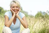 Portrait of mature woman sitting in countryside smiling, Dentists Near Me, Delmar