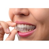 Woman wearing orthodontic silicone trainer. Invisible braces, Connecticut Ave. Cosmetic Dentistry, Washington