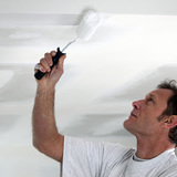 Man painting his ceiling white Master Ceiling Repairs North Melbourne 1B Cherry Court 